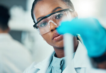 Science, study and black woman with test tube in laboratory, medical engineer and results....