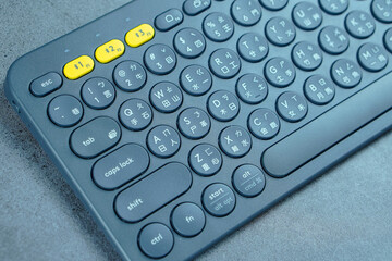 Bluetooth wireless keyboard isolated on gray background 