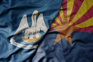 big waving colorful national flag of arizona state and flag of louisiana state .