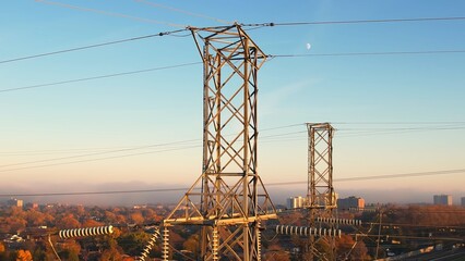 Power tower with electricity. Energy and high voltage electricity pylon at Sunset or golden hour....