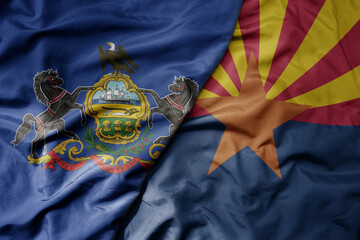 big waving colorful national flag of arizona state and flag of pennsylvania state .