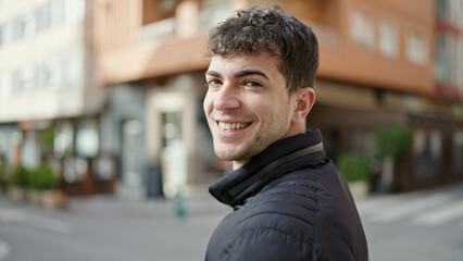 Young hispanic man smiling confident at street