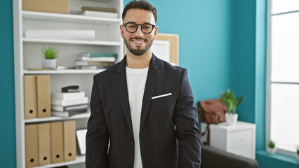 Fototapeta premium Young arab man business worker smiling confident at the office