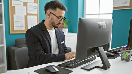 Young arab man business worker using computer at the office