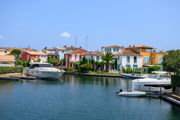 Fototapeta na wymiar Colorful houses in Port Grimaud, village on Mediterranean sea with yacht harbour, Provence, summer vacation France