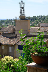 Travel destination, small ancient village Cotignac in Var, Provence, surrounded by vineyards and cliffs with troglodytes houses.