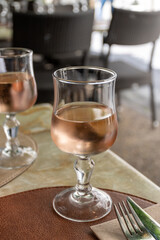 French cold rose dry wine from Provence in glass served for lunch in restaurant, Aigues-Mortes, Gard, France