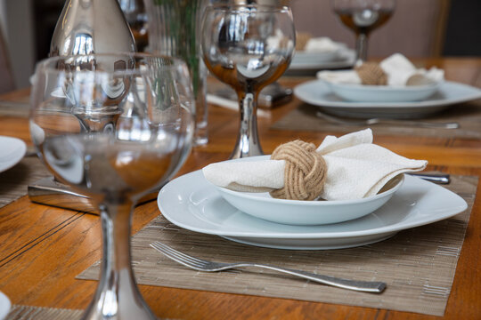 Elagany table setting with glasses, plates and napkins