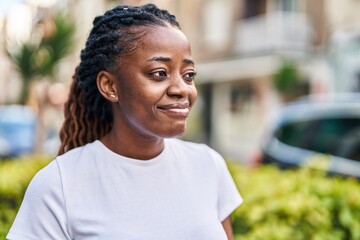Fototapeta premium African american woman smiling confident looking to the side at street