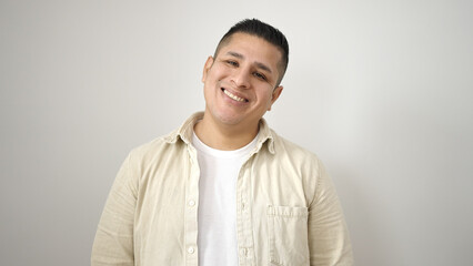 Young hispanic man smiling confident standing over isolated white background