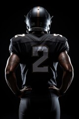 Fototapeta na wymiar American Football Player with dark background