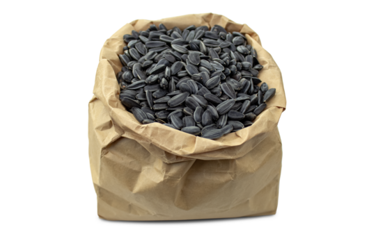 Black seeds in a paper bag isolated on a transparent background.