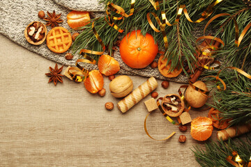 Still life formed with pine branches and New Year sweets