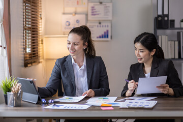 Teamwork asian business woman and Profession businesswomen, accounting concept, doing planning analyzing the financial report, business plan investment, finance analysis financial in office