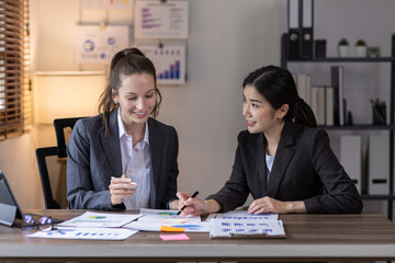 Teamwork asian business woman and Profession businesswomen, accounting concept, doing planning analyzing the financial report, business plan investment, finance analysis financial in office