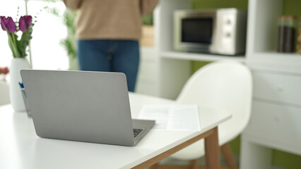 Beautiful hispanic woman standing at street