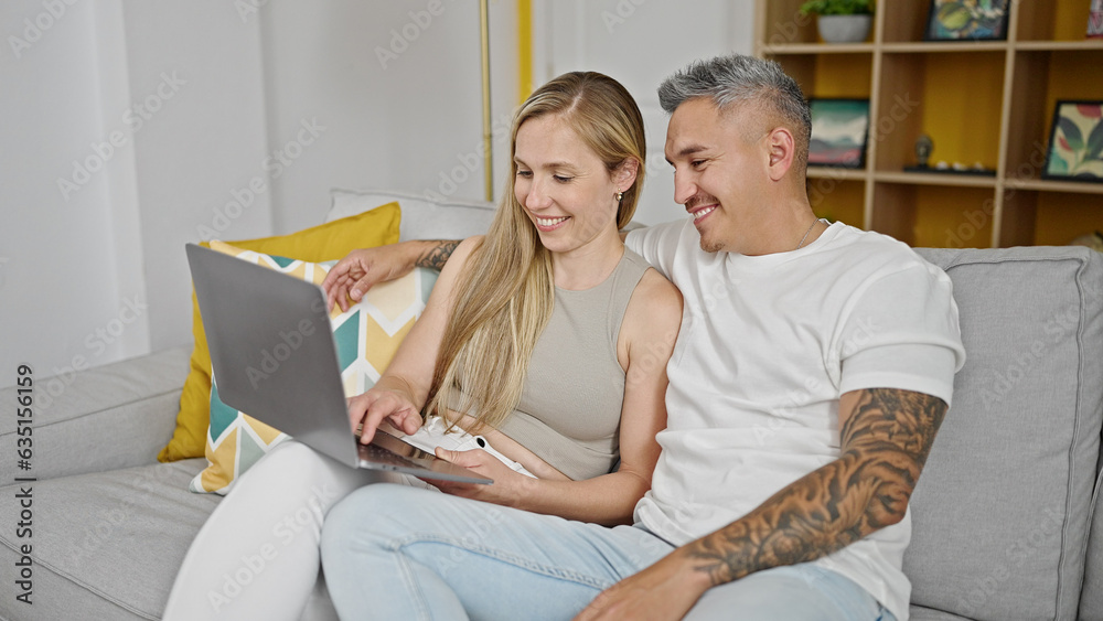 Sticker man and woman couple using laptop sitting on sofa at home