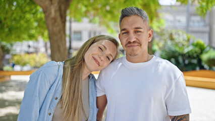 Man and woman couple smiling confident standing together at park