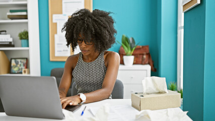 African american woman business worker using laptop at the office