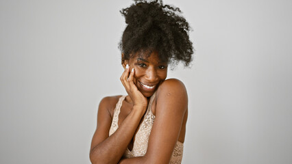 African american woman wearing lingerie touching face smiling over isolated white background