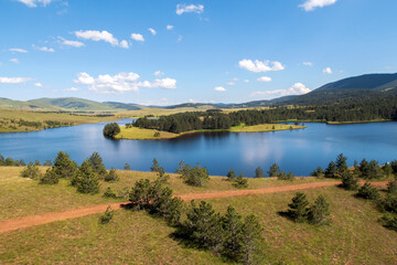 Zlatibor Summer.
Serene altitude lake embraced by mountains