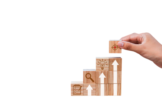 Place wooden blocks as a step towards the goal. Business ideas for successful growth process.PNG