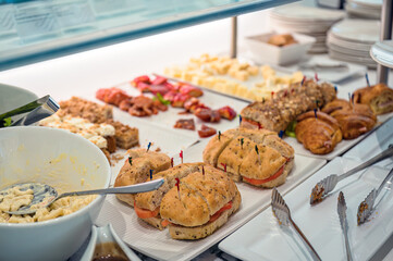 Buffet of bread, dessert and salad on pastry counter