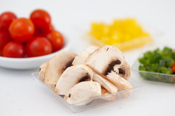 Mushrooms  and other vegetables pizza topping ingredients. Pizza preparation.