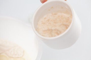 Adding leavened yeast. Home made pizza dough preparation. Pizza preparation.