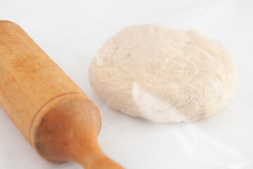 Pizza dough ball ready to stretch. Pizza dough ingredients. Pizza preparation.