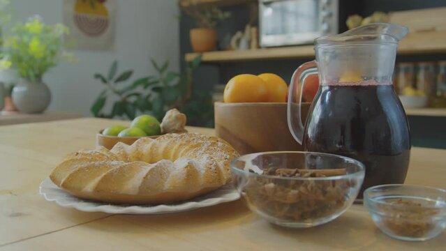 Medium no people shot of traditional North African Meskouta cake and Zobo tea on kitchen table with bowls of spices and fruitMedium no people shot of traditional North African Meskouta cake and Zobo t