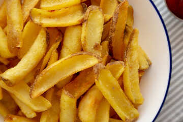 Homemade French Fries on a Plate, top view. Flat lay, overhead, from above. Close-up.