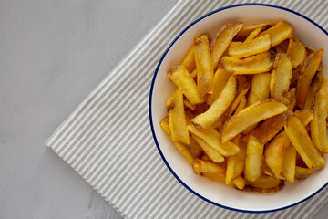Homemade French Fries on a Plate, top view. Flat lay, overhead, from above. Space for text.