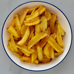 Homemade French Fries on a Plate, top view. Flat lay, overhead, from above. Close-up.