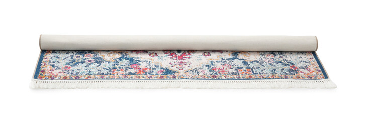 Rolled carpet with pattern on white background. Interior element