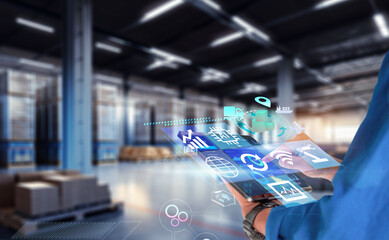 Business Logistics technology concept.Manager hands using tablet on blurred warehouse with full of...