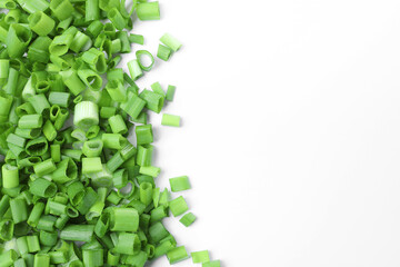 Chopped fresh green onion on white background, flat lay, space for text