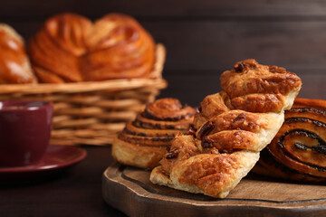 Different tasty freshly baked pastries on table, closeup. Space for text