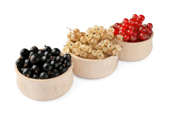 Fresh red, white and black currants in bowls isolated on white