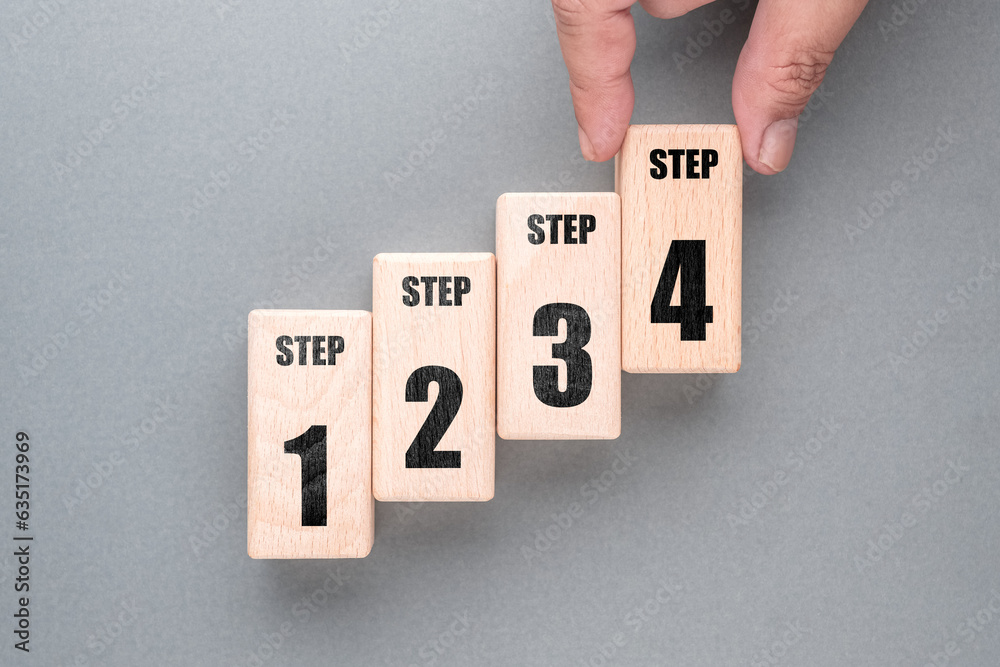 Aufkleber hand arrange the wood blocks as staircase to show the step method from one to four