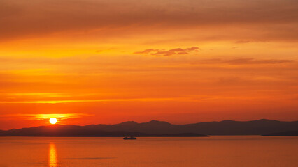 Sunset and seascape in Croatia on mountains background