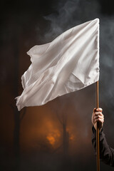 A person holding white flagSurrendering, loosing in war battle, win loose concept. Arm holding stick with a worn white flag in fog on dark vertical background. Generative AI