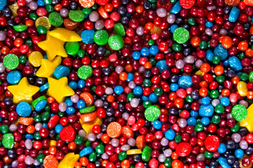 Fototapeta na wymiar small multi-colored balls that are sprinkled on confectionery. Can be used as background