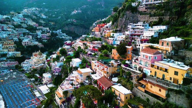 Aerial view of famous Positano in Amalfi coast, Italy: Cascade colorful houses, azure waters	