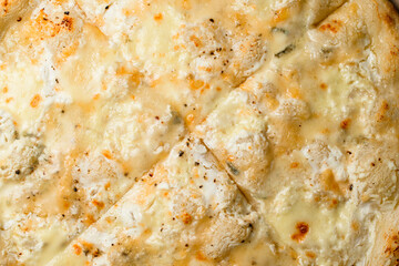 Delicious wallpaper with creamy white pizza Quattro formaggi with gorgonzola, parmesan, mozzarella and ricotta cheese