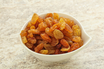 Fototapeta premium Sweet yellow raisin in the bowl