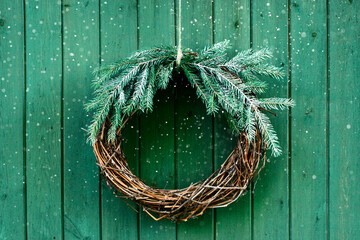 Christmas green decoration on the wooden background, natural festive wreath - 635203355