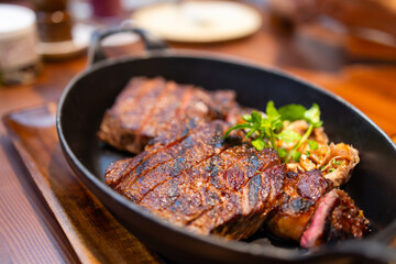 Juicy steak sliced on the plate in restaurant