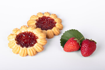 Shortbread with strawberry jam close-up with strawberries on a white background