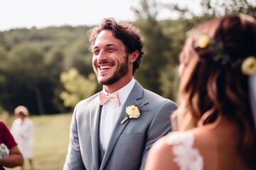 Candid photo of a joyful groom at an outdoor summer wedding, surrounded by nature. His authentic happiness shines, capturing the essence of this lifestyle milestone.